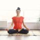 woman meditating on the floor