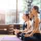 women in a yoga studio meditating