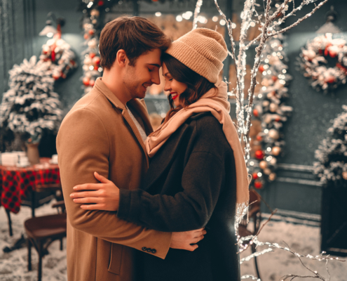 man and woman embracing outdoors