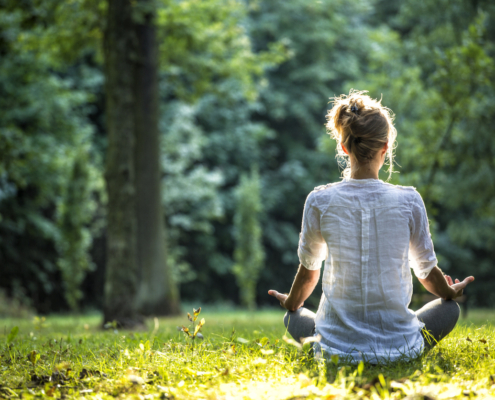 woman sitting alone outdoors
