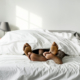 pair of feet sticking out of a bed