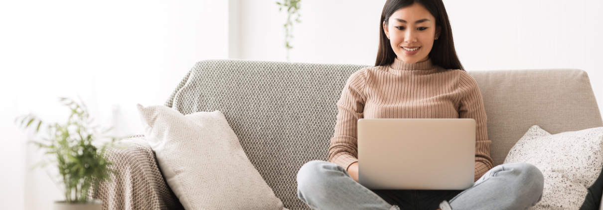 Recruitment Concept. Girl Browsing Work Opportunities Online, Using Job Search App or Website on Laptop, Copy Space