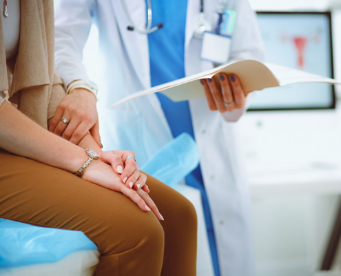 woman being reassured by a doctor